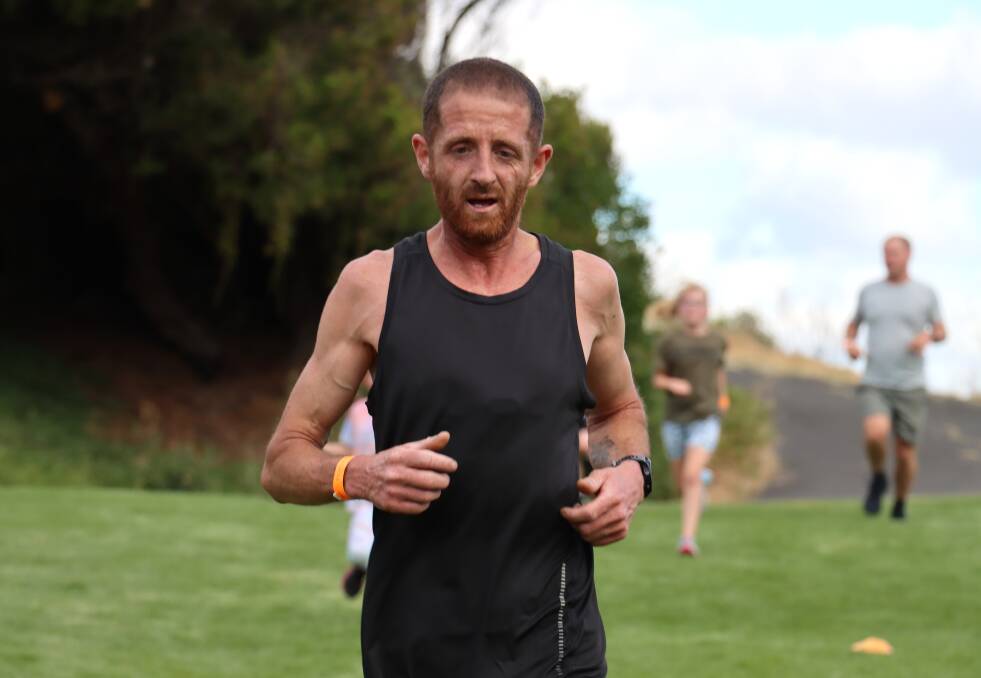 Warrnambool runner Ben Wallis crosses the Flaggy 5 finish line on Wednesday evening. Picture by Justine McCullagh-Beasy 
