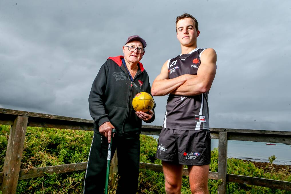 FAMILY TIES: Essendon premiership player Ken Timms, 83, with his grandson Ned Timms, 18. Ned is following in his poppy's football footsteps and will play NAB League in 2021 as he strives to make the AFL. Picture: Chris Doheny 