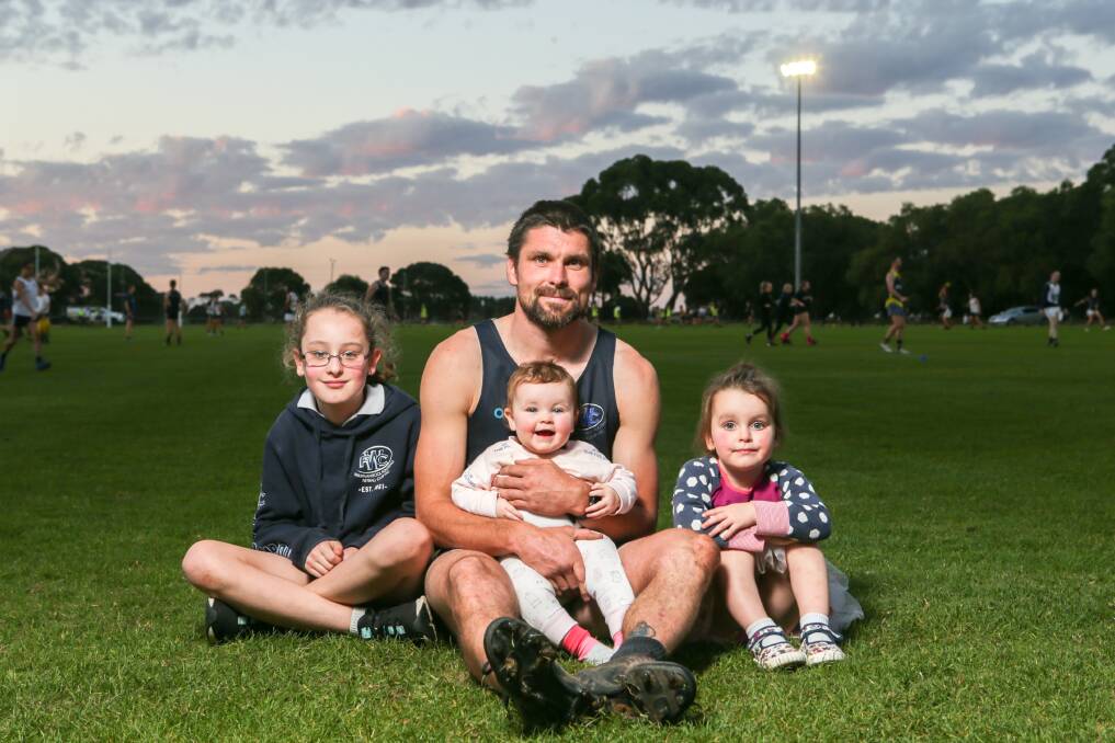 TRUE BLUE: Warrnambool footballer Brad Bull's three daughters - Ava, 9, Marli, 2 and Holly, nine months - are his biggest supporters. Picture: Chris Doheny 