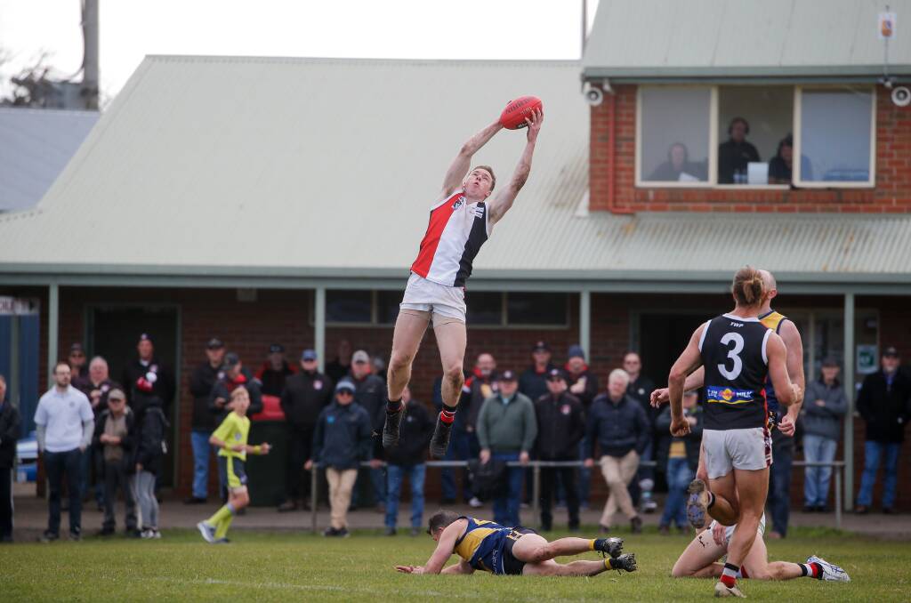 HIGH FLYER: Koroit's Jack O'Sullivan leaps to take a mark in front of the North Warrnambool Eagles' rooms. Picture: Anthony Brady