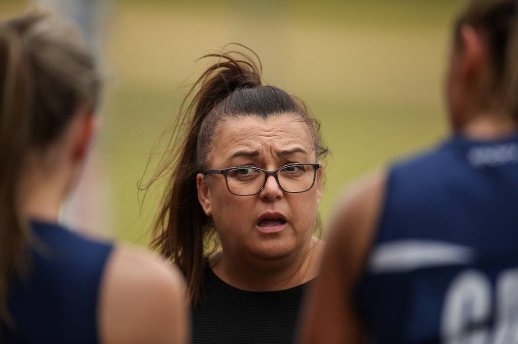LET'S GO: Warrnambool coach Raewyn Poumako speaks to her players at half-time. Picture: Morgan Hancock 