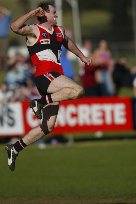 JUMPING FOR JOY: Brad Cassidy celebrates a goal for Koroit in the 2003 decider. 
