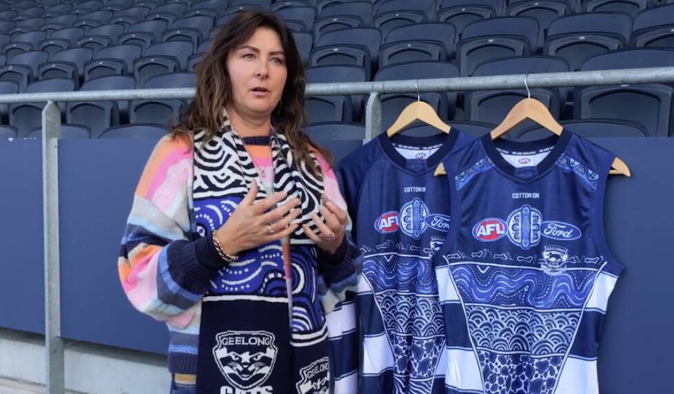 Sherry Johnstone with the Geelong guernseys emblazoned with her artwork. Picture by Geelong Cats 