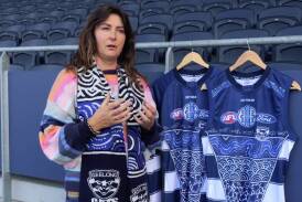 Sherry Johnstone with the Geelong guernseys emblazoned with her artwork. Picture by Geelong Cats 