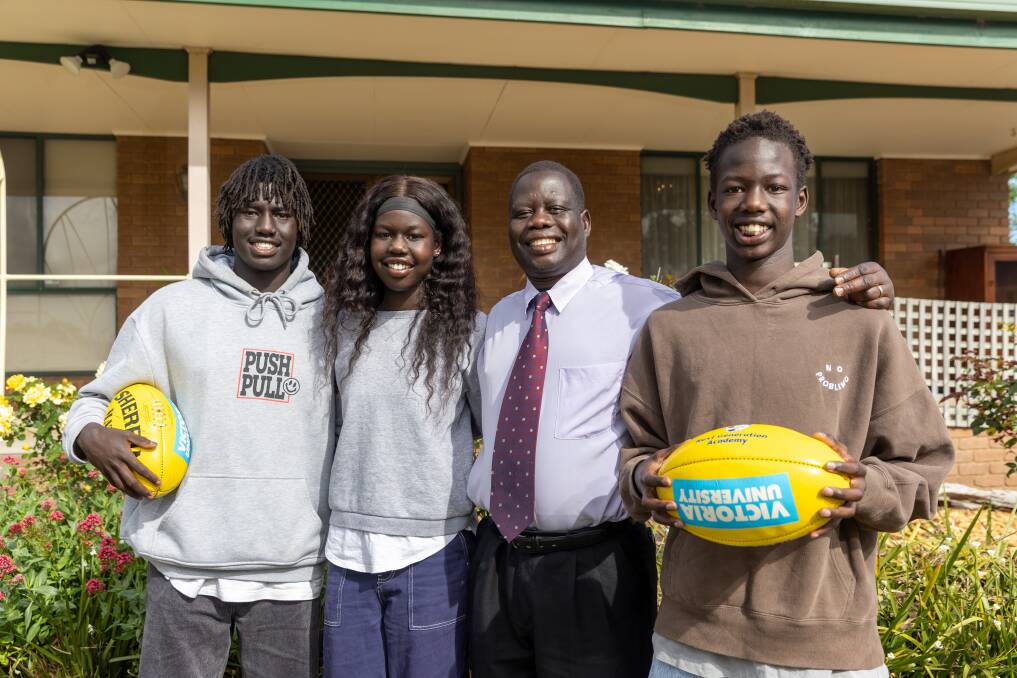 The Lual family - Luamon, Cigi, dad Thomas and Mali - are excited about the AFL draft. Picture by Eddie Guerrero 