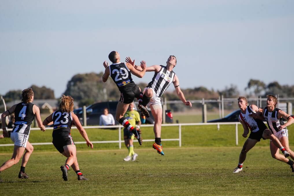SIDELINED: Koroit's Jarrod Korewha goes up in the ruck against Camperdown's Will Rowbottom. Korewha was injured shortly afterwards. Picture: Anthony Brady 