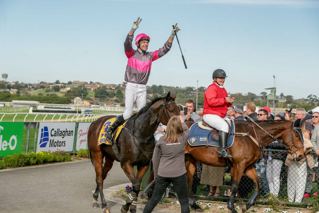 CROWD-PLEASER: Clayton Douglas salutes the fans after winning the Grand Annual Steeplechase aboard Gold Medals. Picture: Chris Doheny 