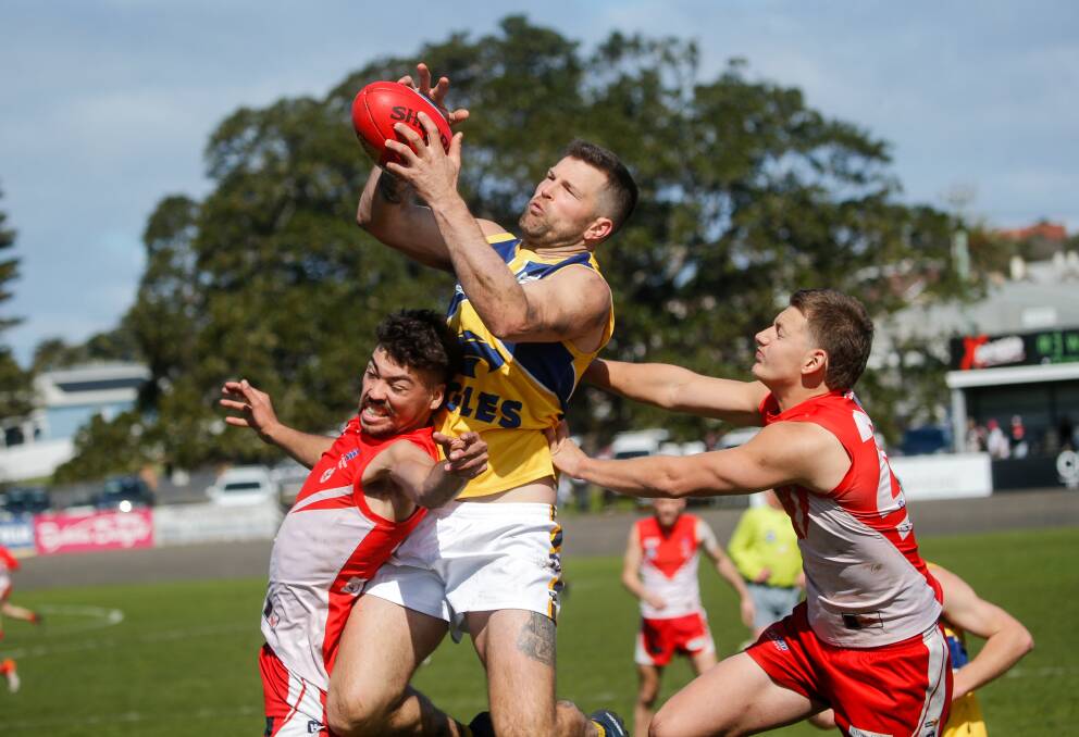 Dylan Parish takes a strong mark for North Warrnambool Eagles in the reserves second semi-final.