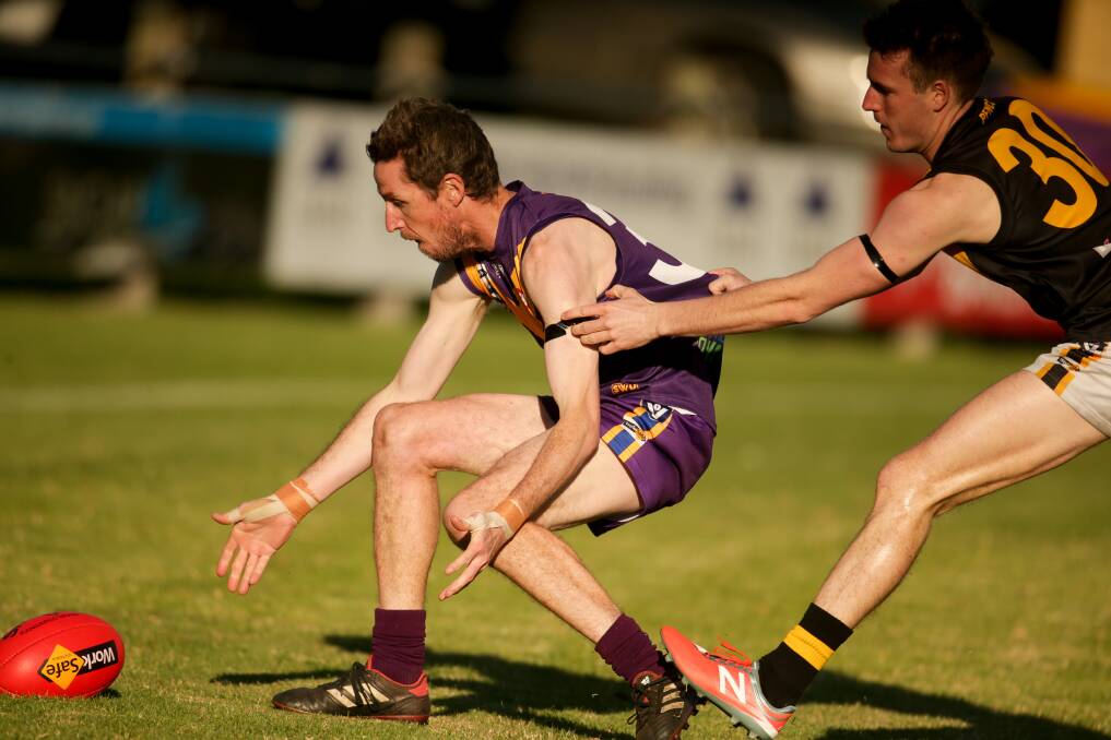 GOTCHA: Seagull Brent Goonan is tackled by Tiger Jackson Dunlop on Saturday. Picture: Chris Doheny 