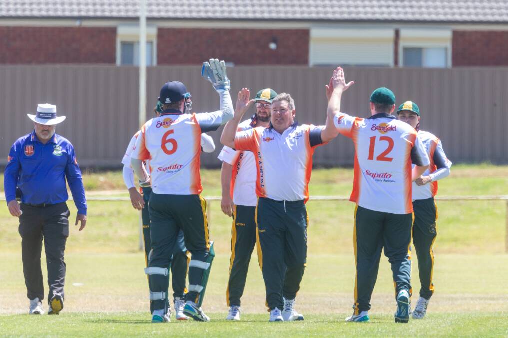 Darren Killmister celebrates with the rest of the Tyrendarras team the fall of the wicket in their Sungold Cup quarter-final against Port Fairy. Picture by Eddie Guerrero