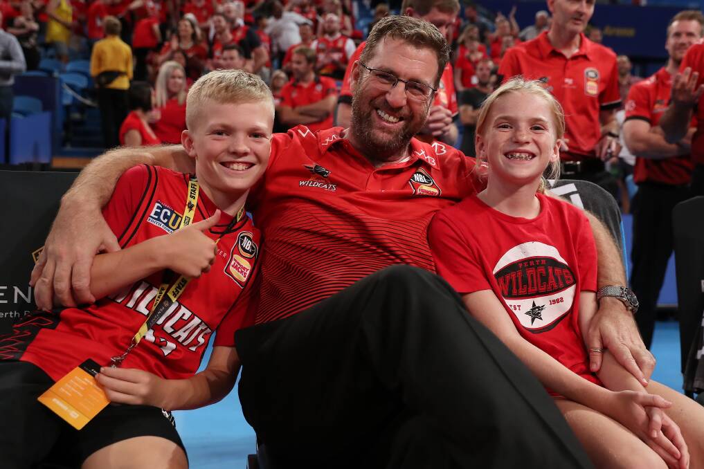 FAMILY FIRST: Trevor Gleeson with children Taj and Shae after a Perth Wildcats' game in 2020. Picture: Getty Images 