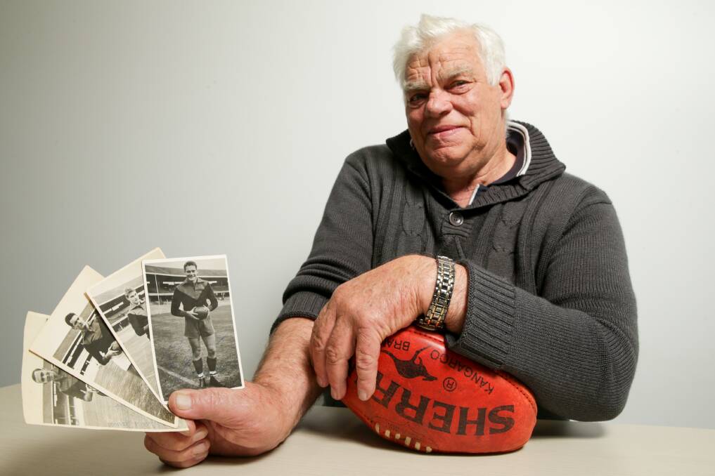 SPECIAL MEMENTOS: Passionate Melbourne fan Jim Turner with his signed photographs, including one of club legend Ron Barassi. Picture: Chris Doheny 