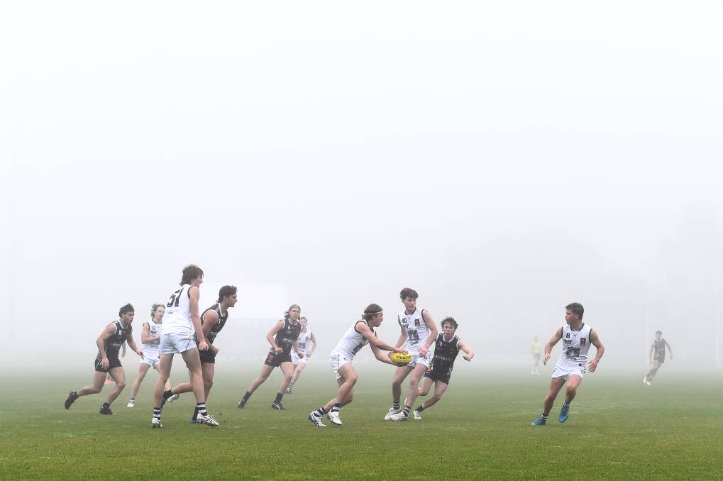VISION IMPAIRED: NAB League players endured foggy conditions in Ballarat on Sunday. Picture: Adam Trafford 