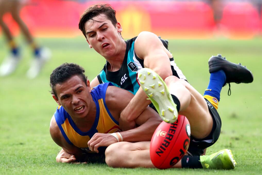 CRUNCH: West Coast's Jamaine Jones battles with Port Adelaide's Connor Rozee for possession earlier this season. Jones has undergone hamstring surgery and will not play again in 2020. Picture: Getty Images 