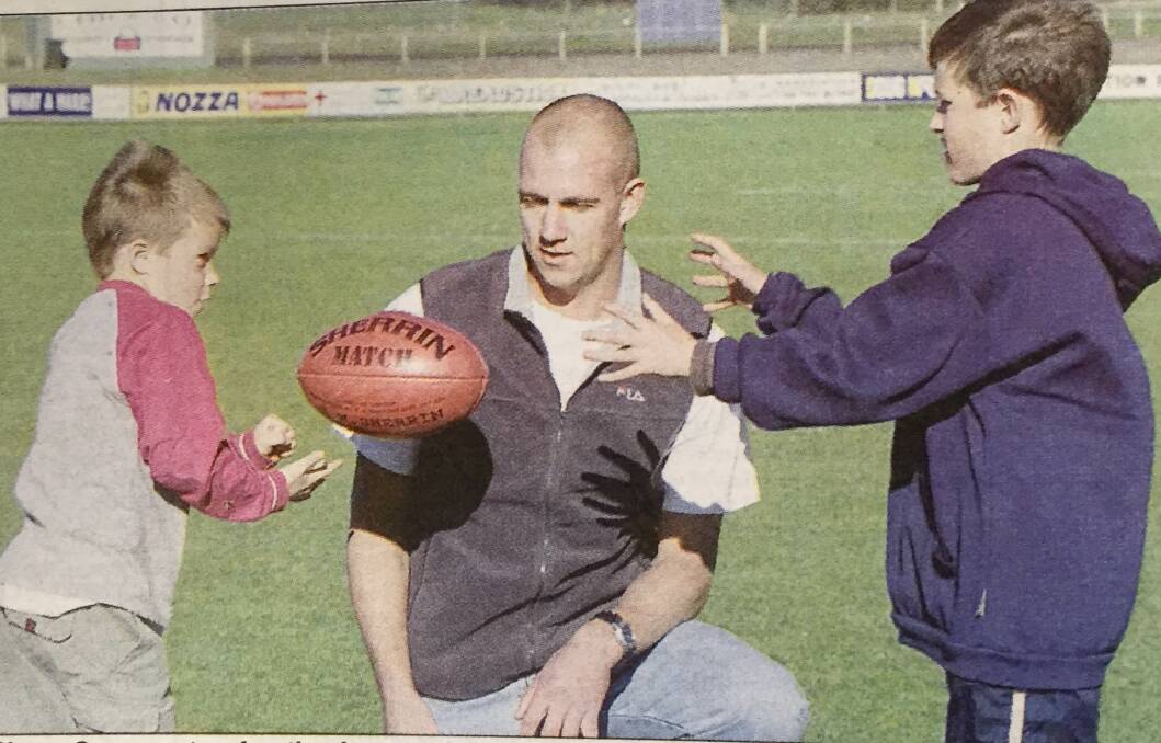 FLASHBACK: Warrnambool's Shane Garner with his nephews Zach and Jackson Merrett in June 2002. 