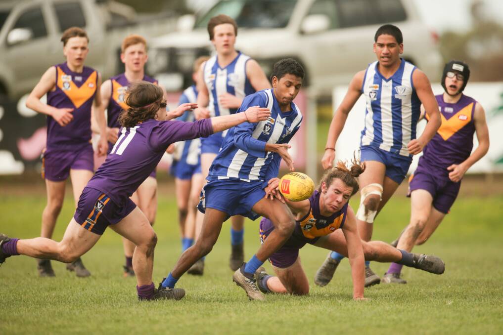 CONTESTED WORK: Hamilton Kangaroos' Brent Mullins tries to get the ball out of a pack against Port Fairy in the under 16 semi-final. Picture: Chris Doheny