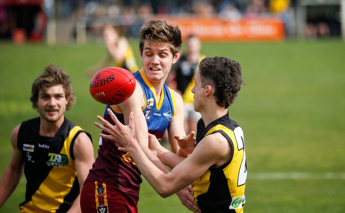 IT'S MINE: South Rovers' Jack Dowd and Merrivale's Tyler Stephens vie for possession during the Warrnambool and District under 18 grand final last year. Picture: Anthony Brady