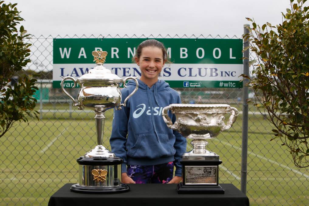 MOMENTO: Young Warrnambool tennis player Adele McNamara with the Australian Open trophies. Picture: Emma Stapleton 