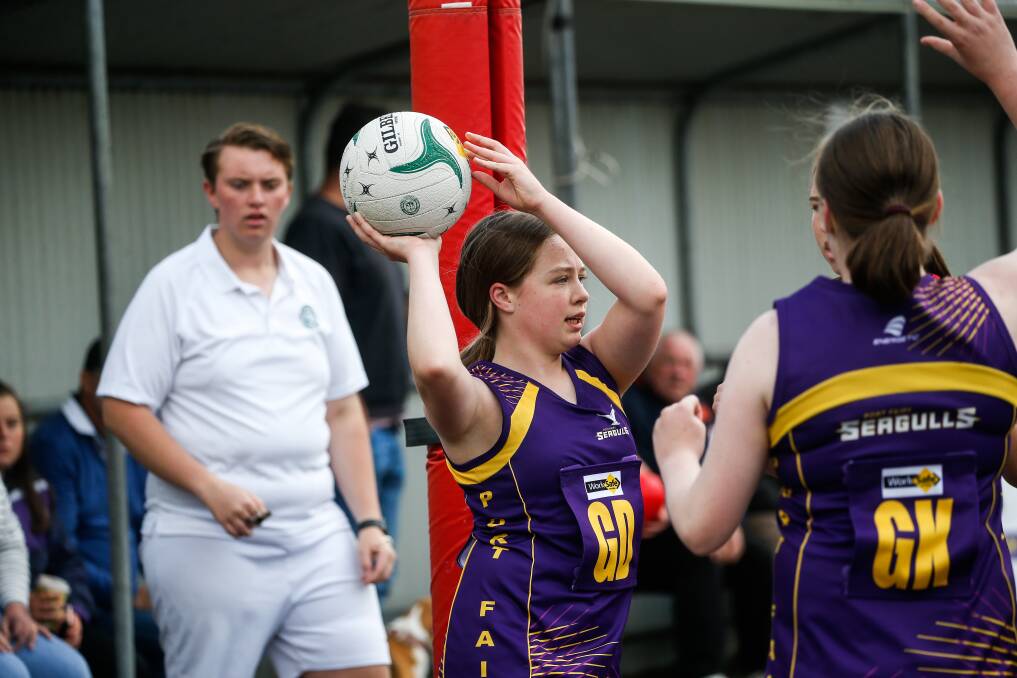 KEEPING THE GAME GOING: Umpires help officiate Hampden league netball games. Picture: Anthony Brady