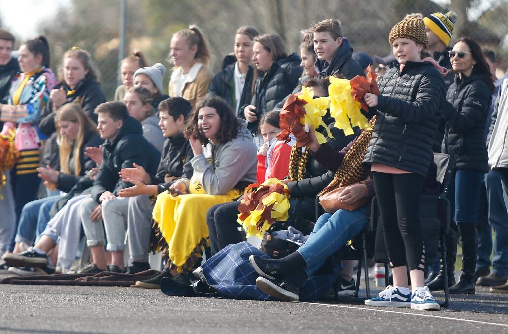 C'MON: Fans don their club colours during a junior finals series last year. Picture: Mark Witte 