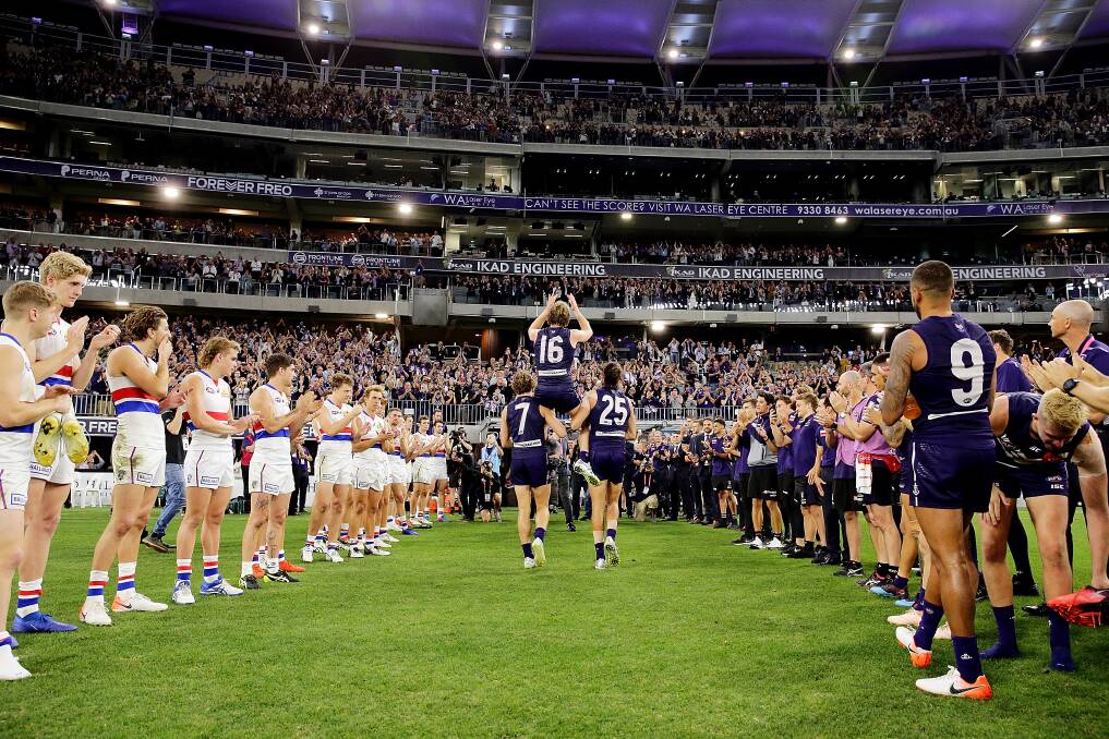 FOR THE MASSES: Crowds, such at the one which watched David Mundy's 300th game last year, will return to Optus Stadium. Picture: Getty Images 