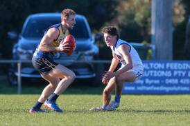 North Warrnambool Eagles' Michael Barlow slips around Hamilton's Jack English during a 2019 match. File picture 