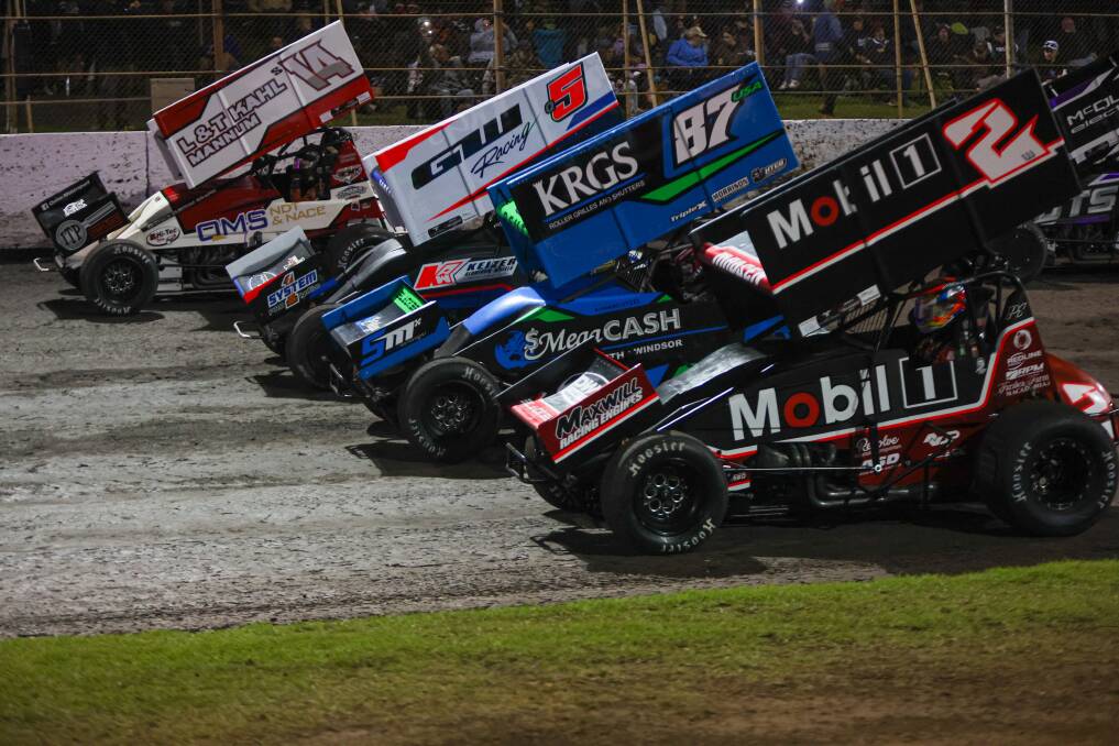 Brendan Quinn, Brock Hallett, Aaron Reutzel and Kerry Madsen go four wide at the 2024 Grand Annual Sprintcar Classic. Picture by Eddie Guerrero 