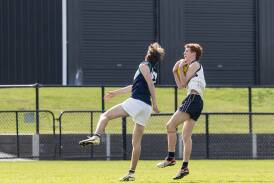 Leo Ellerton (South Warrnambool) takes a chest mark for Emmanuel College. Picture by Anthony Brady 