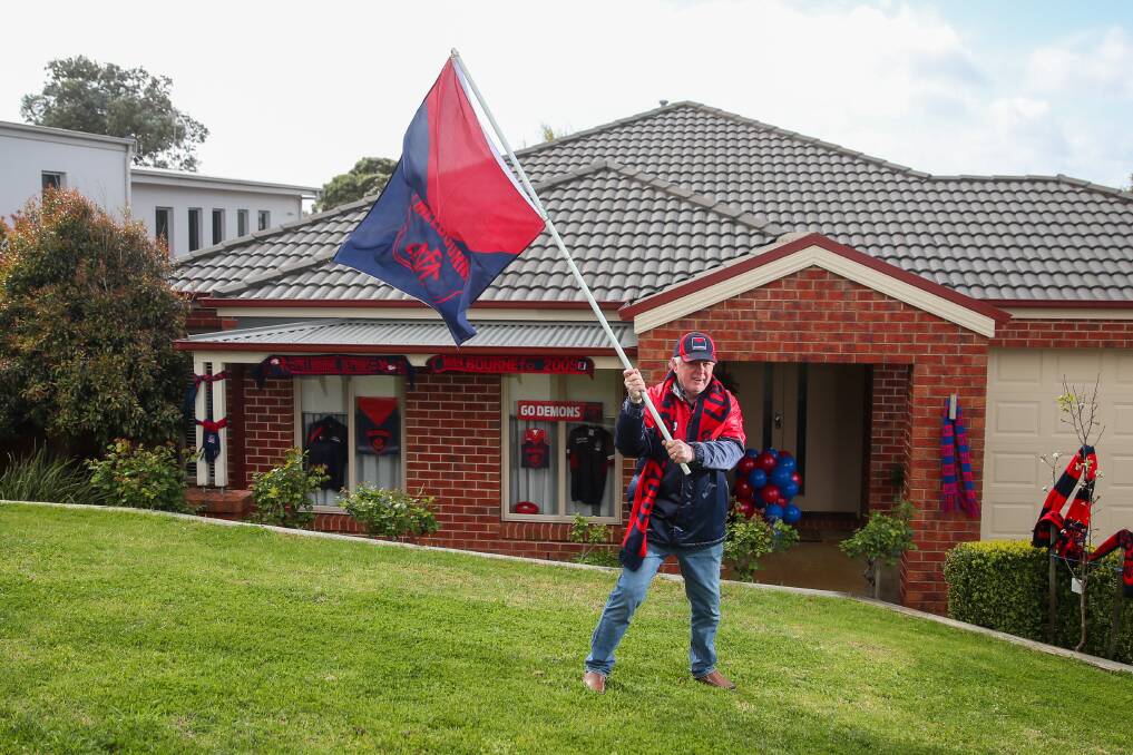 DEE-LIGHTED: Melbourne supporter Mick Brooks has decorated his home in red and blue in support of the grand final-bound Demons. Picture: Morgan Hancock 
