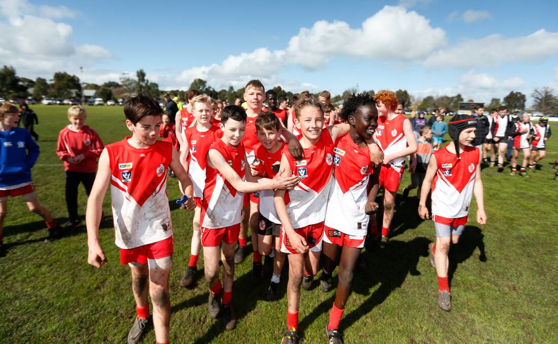 MATESHIP: South Warrnambool's under 14 footballers celebrate their 2019 premiership. Picture: Mark Witte 