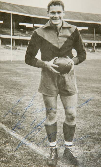 HISTORY: A signed photo of Melbourne legend Ron Barassi from his playing days. 