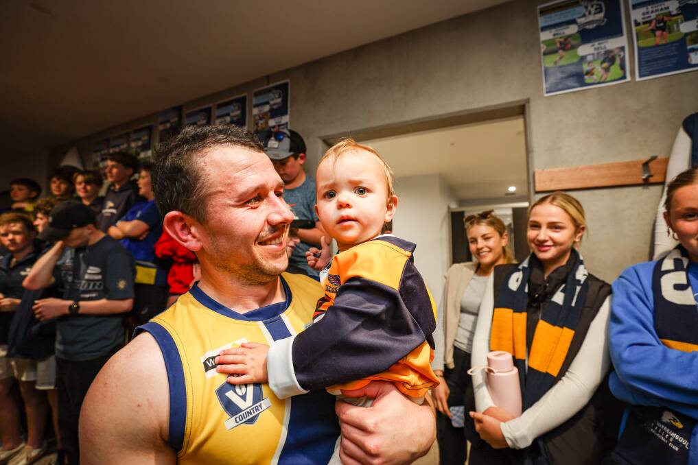 Jarryd Lewis and daughter Gigi celebrate North Warrnambool Eagles' preliminary final win. Picture by Sean McKenna 