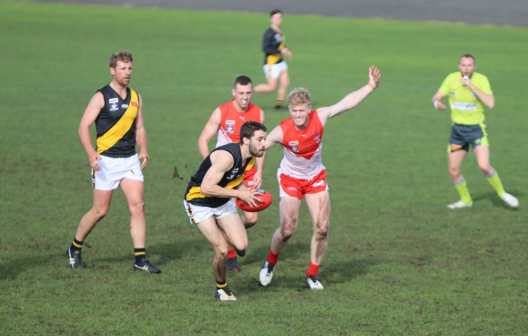 ATTACKING PLAY: Portland's Josh Jenner tries to get around South Warrnambool's Harry Lee. Picture: Justine McCullagh-Beasy
