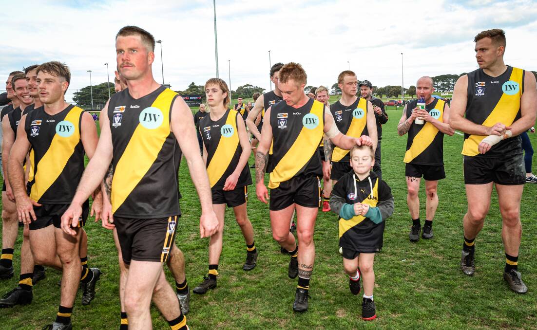 Hamish Gurry (second from left) walks off the ground after Merrivale's preliminary final win. Picture by Sean McKenna 