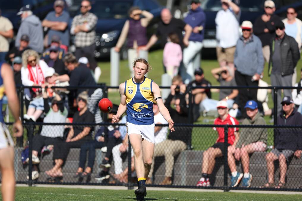 A big crowd watches Charlie McKinnon, who was playing with injury, in the 2023 Hampden league football grand final. Picture by Eddie Guerrero 
