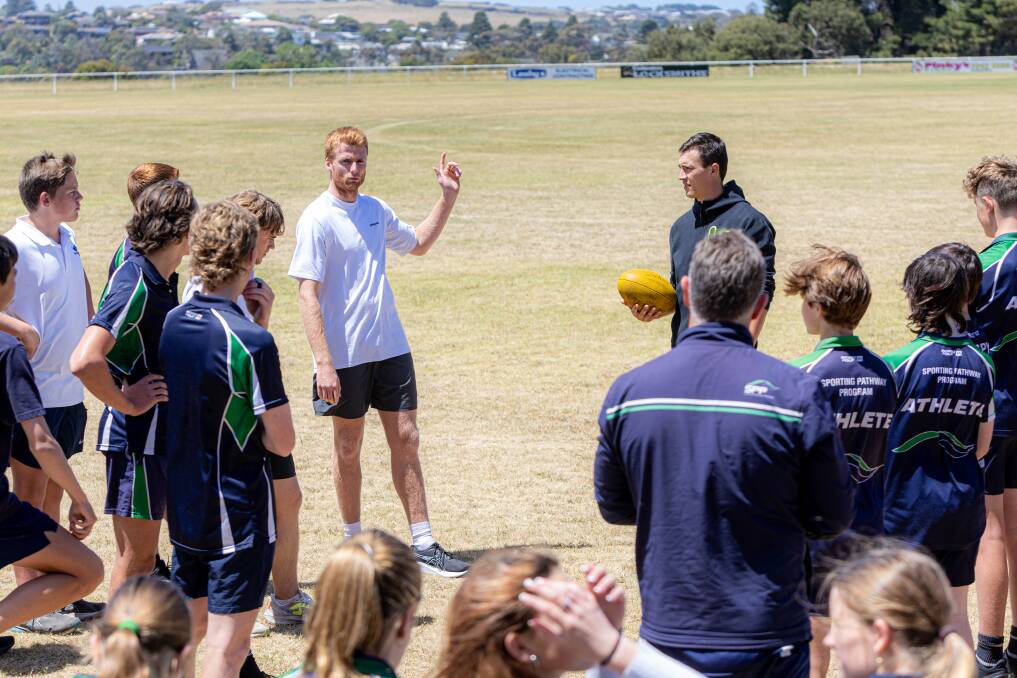 Willem Drew and Hugh McCluggage run Warrnambool College students through a drill. Picture by Eddie Guerrero 