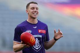 Fremantle's Josh Corbett enjoys a laugh before an AFL match in 2023. Picture by Getty Images 