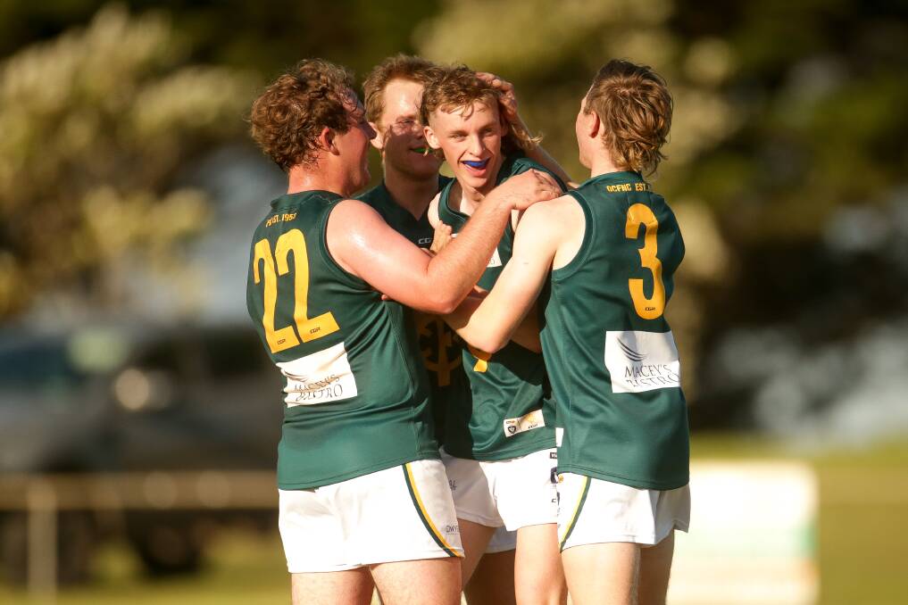 GOOD START: Jayden Cleaver (middle) celebrates a goal in his first senior game for Old Collegians. Picture: Chris Doheny 