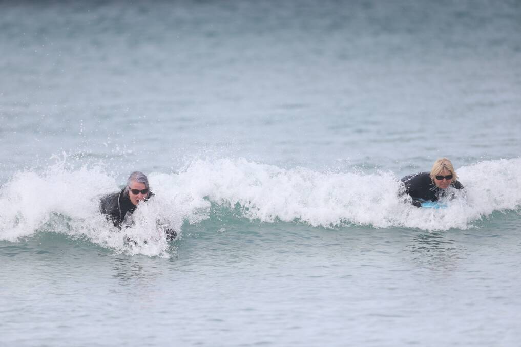 IN NATURE: Bodyboarders Trish Taylor, and Chris Van Kempen catch a wave in Warrnambool on Wednesday. Picture: Mark Witte