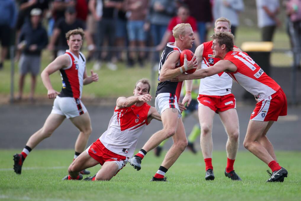 GOTCHA: Koroit's Alex Pulling is wrapped up in a South Warrnambool tackle. Picture: Morgan Hancock 