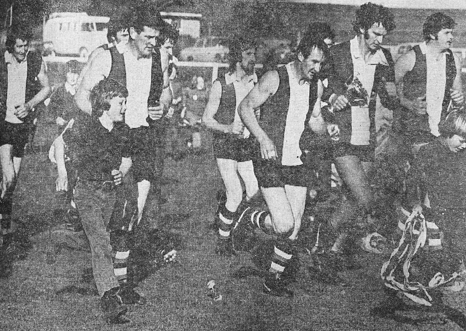 VICTORY: Koroit players celebrate their 1973 premiership. 