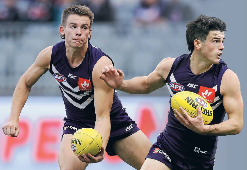 MIDFIELD BUDDIES: Caleb Serong and Andrew Brayshaw are helping add another dimension to Fremantle's midfield in 2020. Pictures: Getty Images 