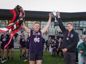 Nirranda captain Reagan Nutting and coach Nick Couch lift the 2023 WDFNL premiership cup aloft. Picture by Sean McKenna 