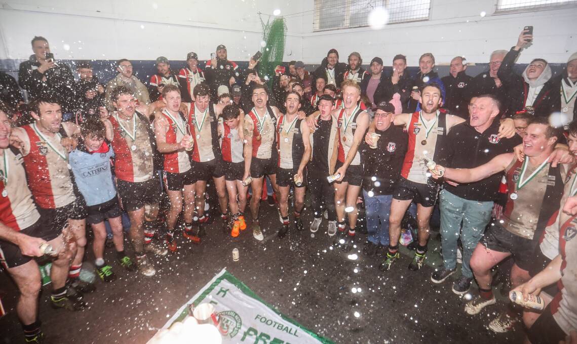 'THE TEAM WE LOVE SO DEAR': Koroit players and fans sing the song after winning their sixth premiership in a row. Picture: Morgan Hancock