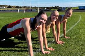 South Warrnambool netballers Meg Carlin, Ally Mellblom and Hollie Phillips are committed to the push-up challenge. Picture supplied 