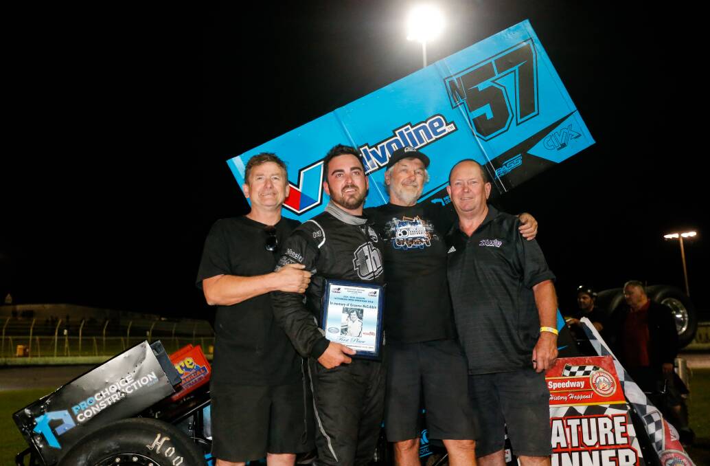 LOVE OF THE SPORT: Max Dumesny (right) with son Matthew (second from left) at Premier Speedway on Saturday night. Matthew won the Victorian title. Picture: Anthony Brady 
