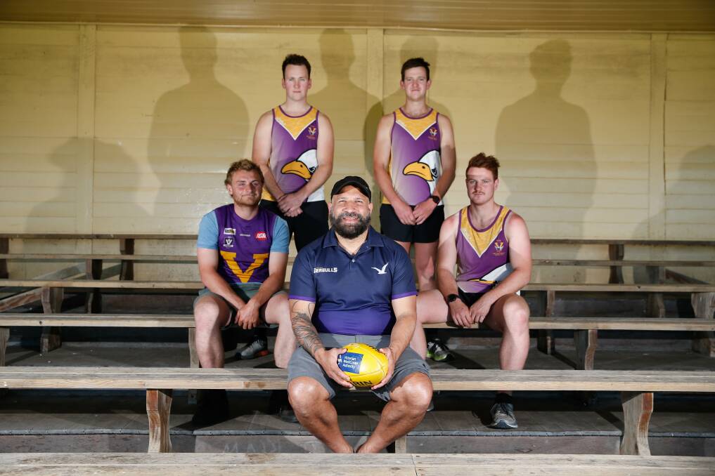 FLYING AS ONE: Port Fairy players Andy McMeel, Colin Harwood, Eddie Purvis and Kaine Mercovich with new coach Winis Imbi. Picture: Mark Witte
