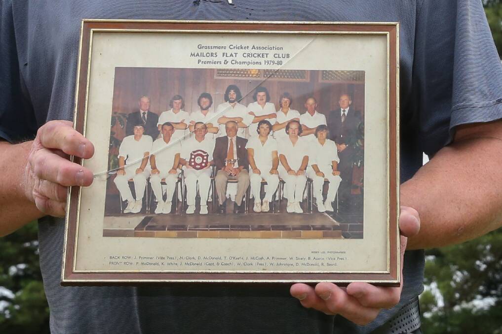 THE BEST: John McCosh holds the 1979-80 Mailors Flat premiership team photo which also included Kevin White and John 'Jakes' McDonald. Picture: Mark Witte
