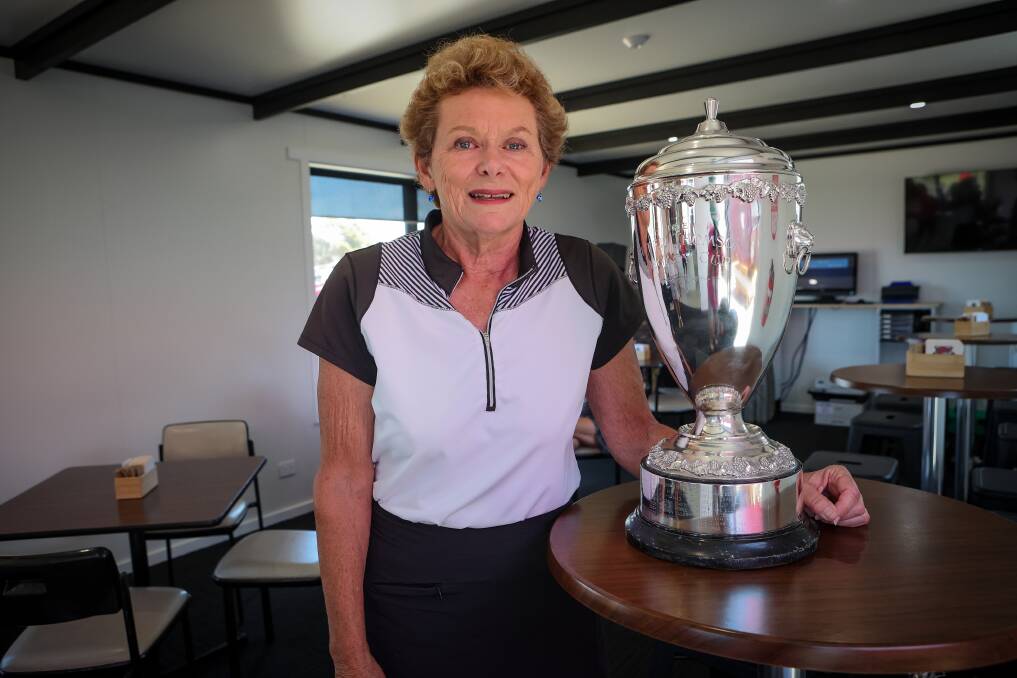 Long-time competitor Betty Holscher with Warrnambool Golf Club's Peter Thomson Cup. It's a perpetual trophy honouring its Legacy Day winners. Picture by Anthony Brady 