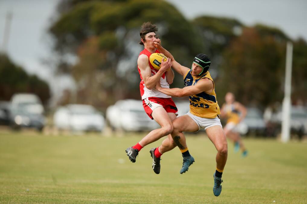 CONTACT: South Warrnambool's Sam Lenehan battles North Warrnambool Eagles' Dion Johnstone. Picture: Chris Doheny 